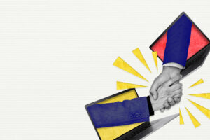 Deux salariés se serrent la main pour indiquer une embauche. 